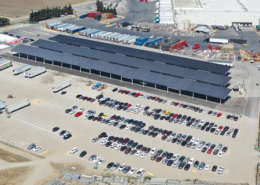 Daytime aerial view of a solar carport at Taylor Farms