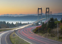 Evening time lapse showing traffic moving across a suspension bridge in Washington state