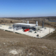 Daytime view of a renewable natural gas plant at Repubic Services Brickyard Landfill
