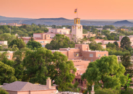 Sunset view of the Santa Fe, New Mexico skyline with mountains in the distance