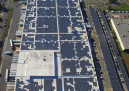 Daytime aerial view of solar panels on the roof of a USPS building in Bellmawr New Jersey