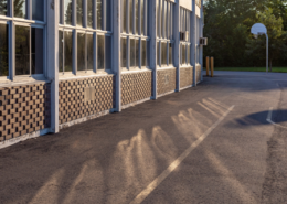 Daytime view of a basketball net outside a Warren Woods school building in Michigan