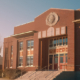 Early morning exterior view of a brick school building in the neoclassical style.