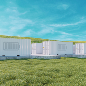 atlantic-green-bess-case-study-featured-image Daytime exterior view of battery energy storage system enclosures in a field under a blue sky