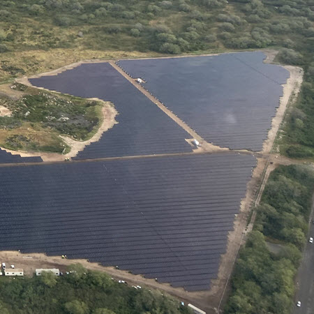 jupono-solar-case-study-featured-image Daytime aerial view of a solar farm in Kupono Hawaii