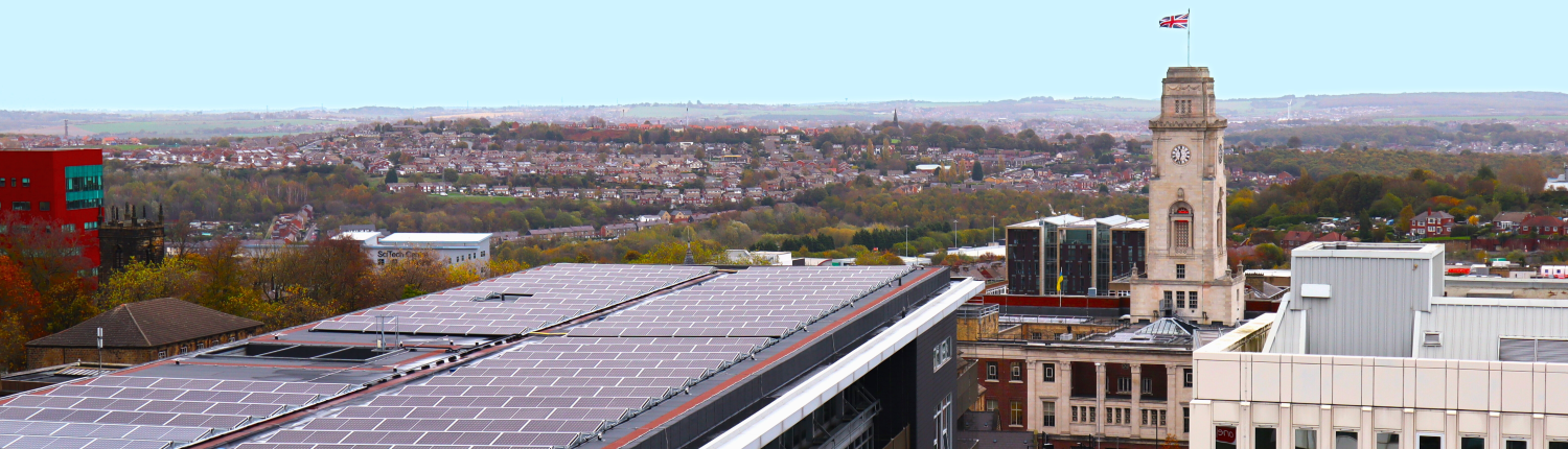 Daytime view of solar panels on the roof of a parking structure in the United Kingdom