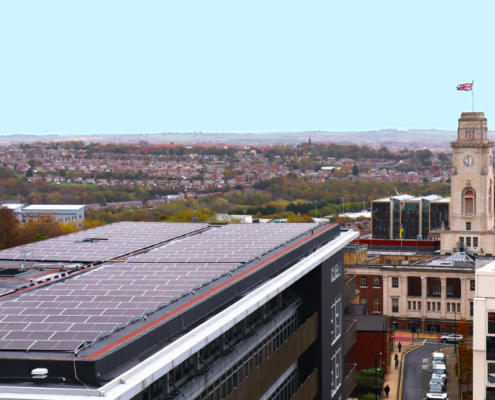 Daytime view of solar panels on the roof of a parking structure in the United Kingdom