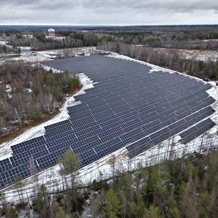 gagetown-base-energy-resilience-featured-image Daytime aerial view of solar panels at the 5th Canadian Division Support Base in New Brunswick