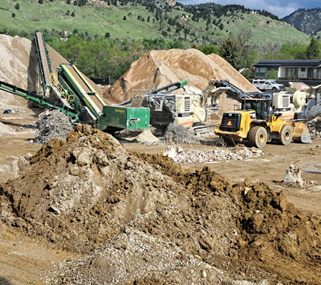 Daytime view of a rock crushing operation in Boulder