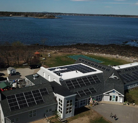 Aerial view of solar panels on the roof of the Seacoast Science Center in New Hampshire