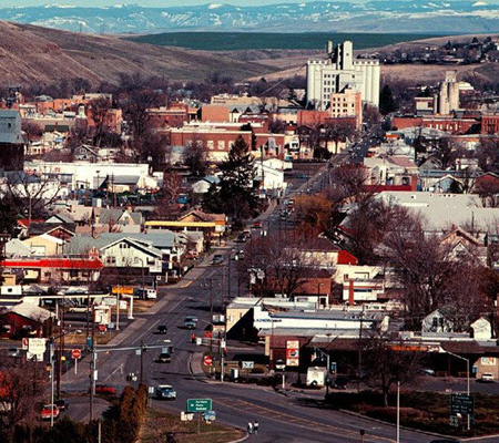 Daytime view of a section of Pendleton with mountains in the distance