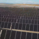 Daytime view of rows of solar panels in a San Joaquin brownfield solar farm
