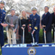 Daytime exterior view of officials at a groundbreaking at the U.S. Coast Guard Academy in New London