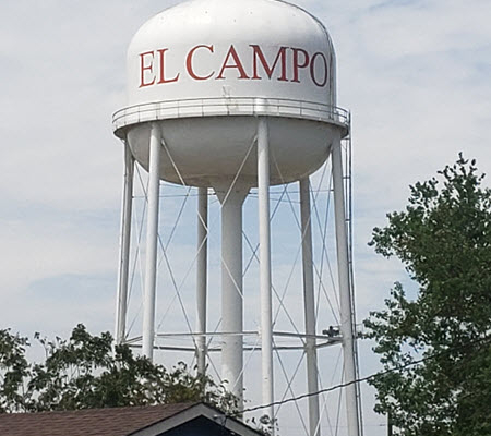Daytime view of an El Campo municipal water system tower