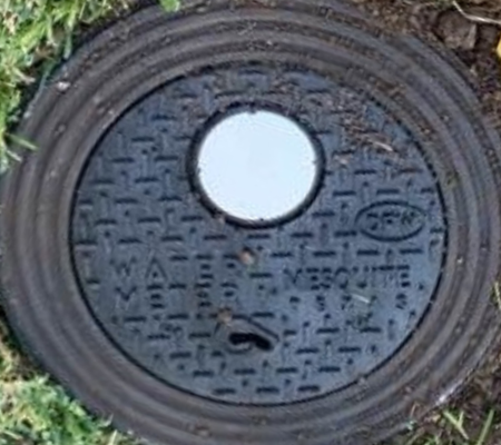 Daytime view of a smart municipal water meter cover in Mesquite Texas