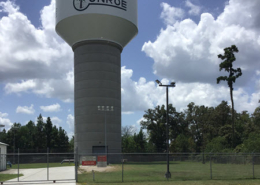 Daytime view of a municipal water tower in Conroe