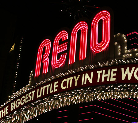Night time view of the Reno welcome sign with the words The Biggest Little City in the World