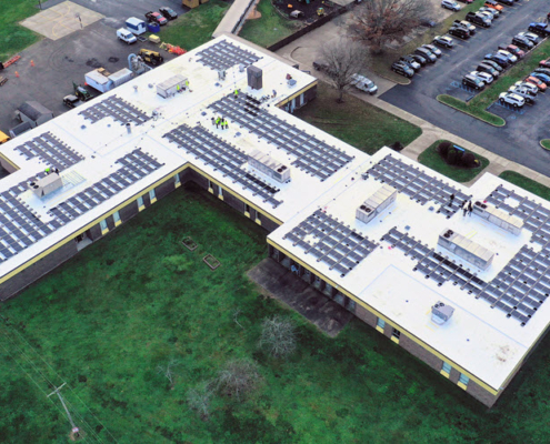 Daytime overhead aerial view of solar panels on the roof of the Tri-County Career Center