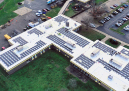 Daytime overhead aerial view of solar panels on the roof of the Tri-County Career Center