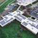 Daytime overhead aerial view of solar panels on the roof of the Tri-County Career Center