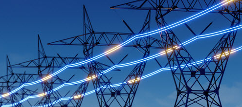 Grid modernization concept image shows a row of high-tension electrical towers connected by blue and yellow lines of light
