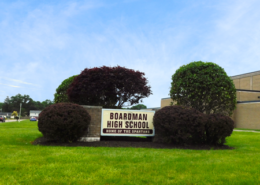 Daytime view of a sign outside Boardman High School reading Home of the Spartans
