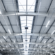 LED area lighting shown looking up at the interior of a warehouse