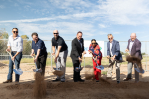 Daytime view of seven Ameresco and City of Chandler leaders breaking ground on an energy project