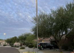 Evening view of a neighborhood lit by municipal LED streetlights