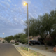 Evening view of a neighborhood lit by municipal LED streetlights