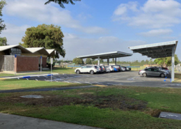 Daytime exterior view of K-12 school solar car ports in Orange Unified School District