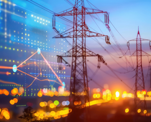 Power transmission towers against a sunset sky with a transparent overlay of charts and digital data points.