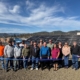 Roseburg Urban Sanitary Authority OR people at ribbon cutting in front of solar panel