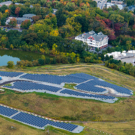city-of-lowell-project-highlight-featured-image Aerial view of a landfill solar farm in the City of Lowell